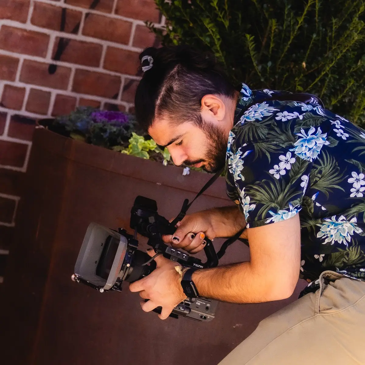 Javier operating a Sony cinema camera on location